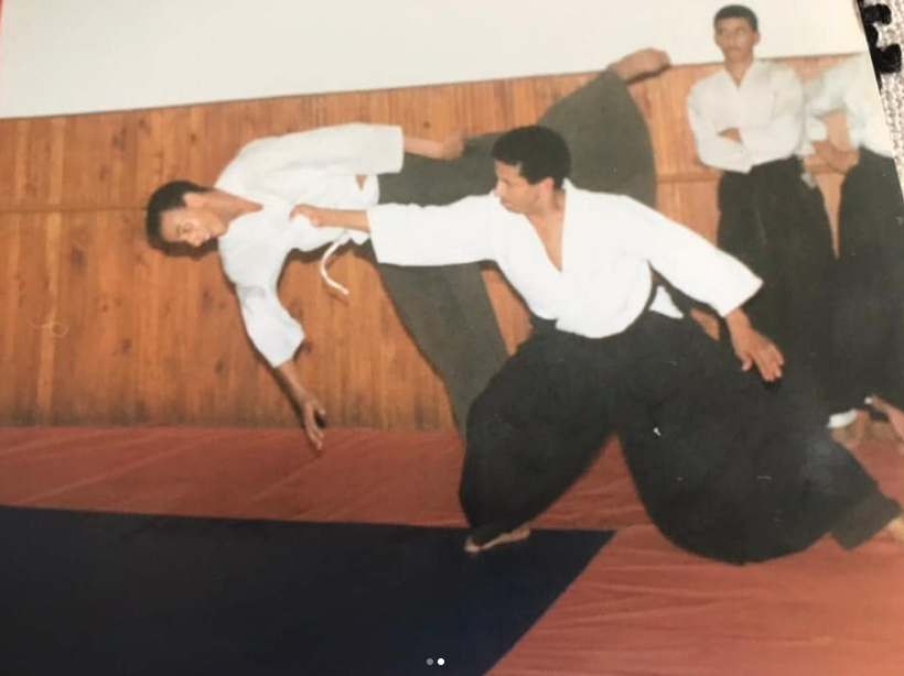 A flowing Aikido technique mid-motion