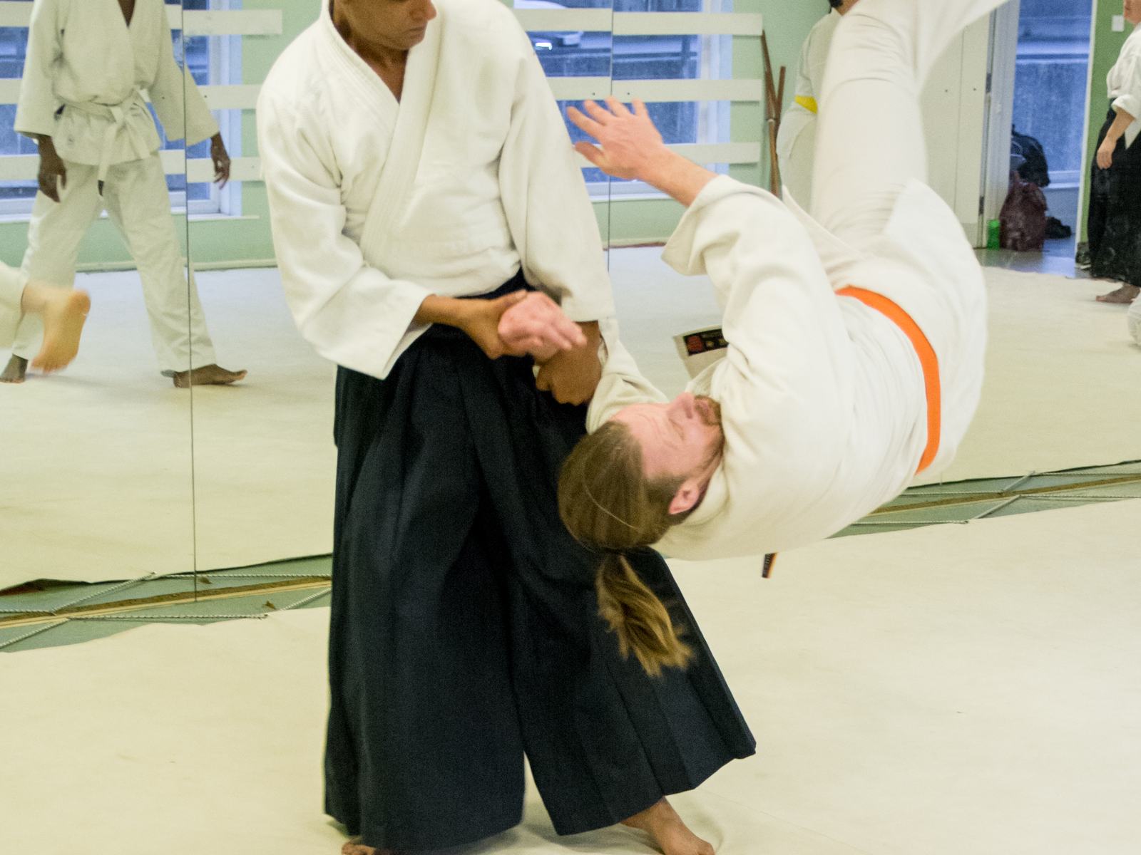 A student mid-breakfall during training