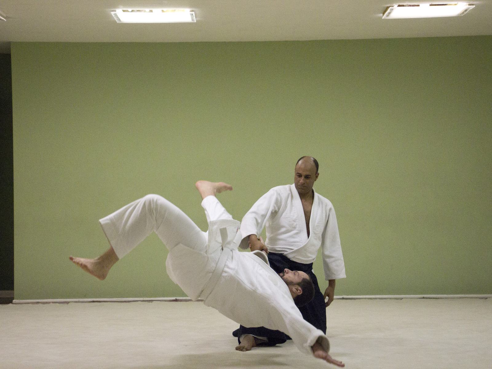 A student mid-breakfall during training