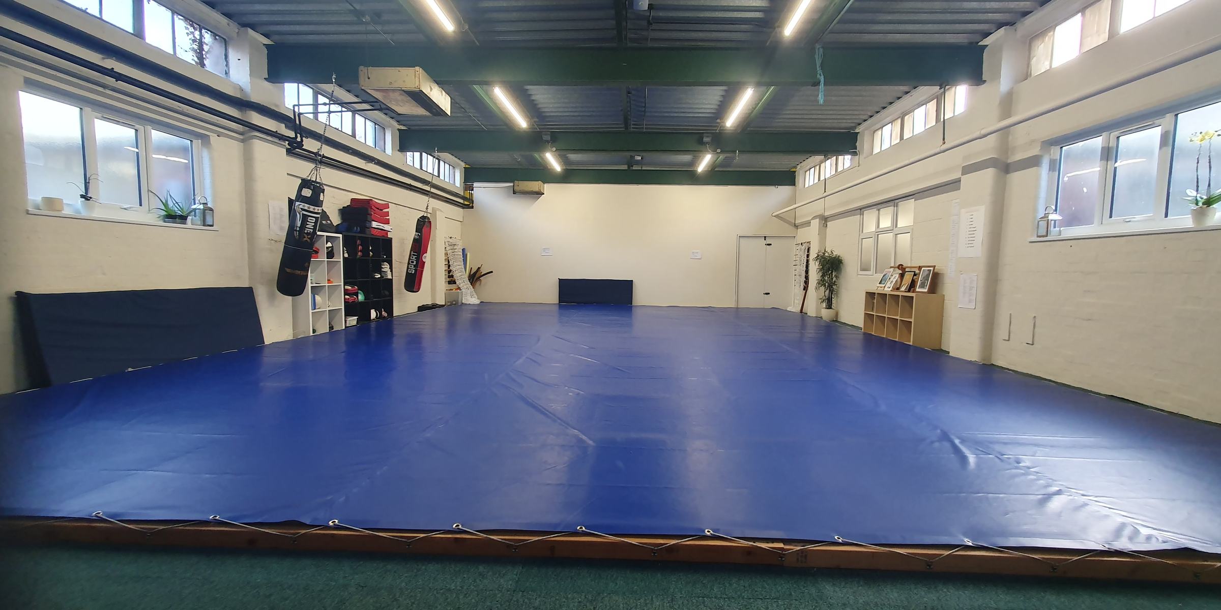 Natural light falling across the training hall at Hizashikan